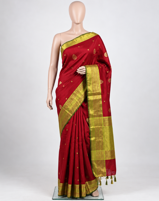 Pure silk pure zari handwoven maroon red tone Kanjivaram saree with a contrast parrot green Korvai border