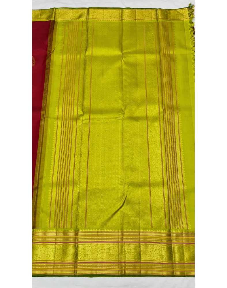 Pure silk pure zari handwoven maroon red tone Kanjivaram saree with a contrast parrot green Korvai border