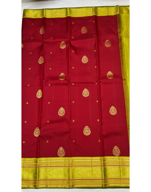 Pure silk pure zari handwoven maroon red tone Kanjivaram saree with a contrast parrot green Korvai border