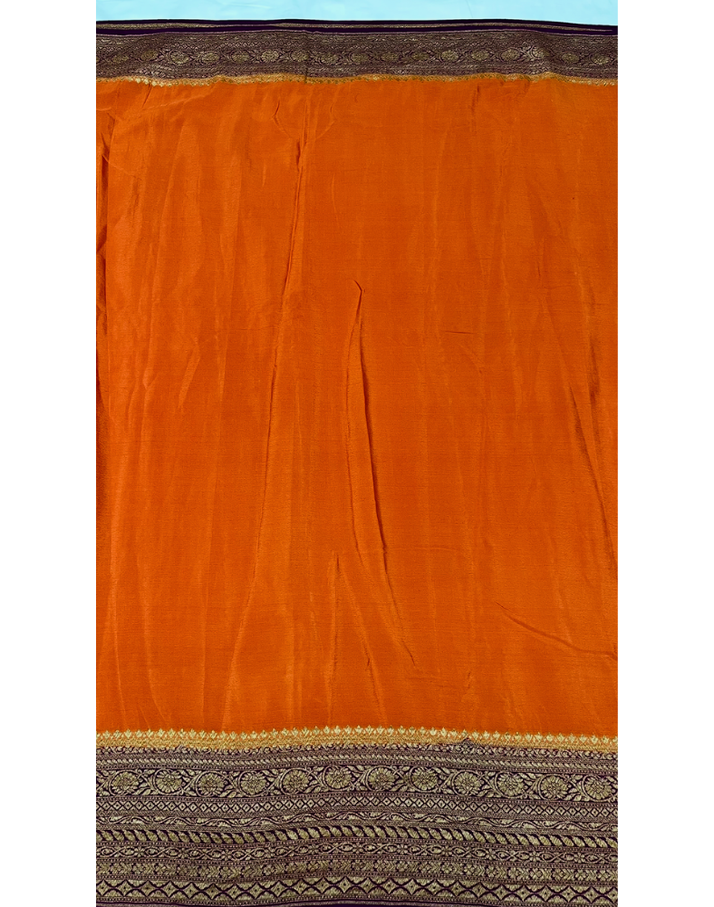 Rust orange pure Banarasi Khaddi crepe silk saree with contrast wine border
