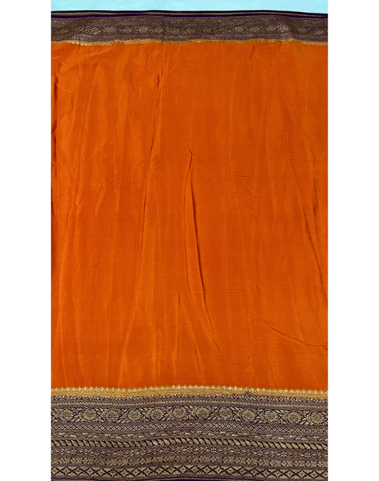 Rust orange pure Banarasi Khaddi crepe silk saree with contrast wine border