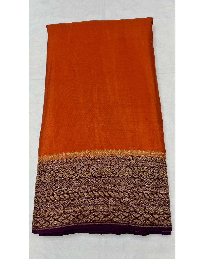 Rust orange pure Banarasi Khaddi crepe silk saree with contrast wine border