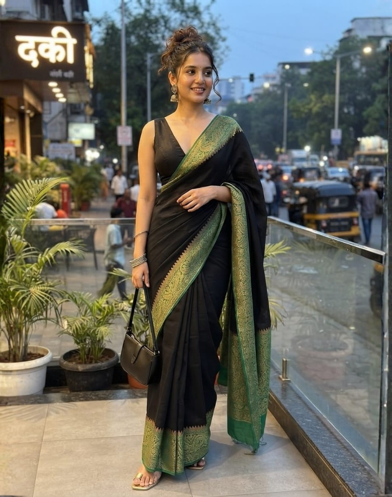 Black pure Banarasi Khaddi crepe silk saree with forest green border